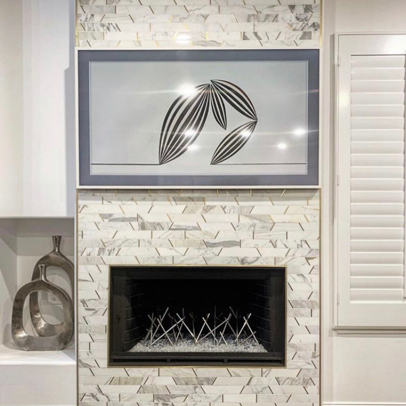 Matrix Trapezoid Marble and Brass Tile example in fireplace 