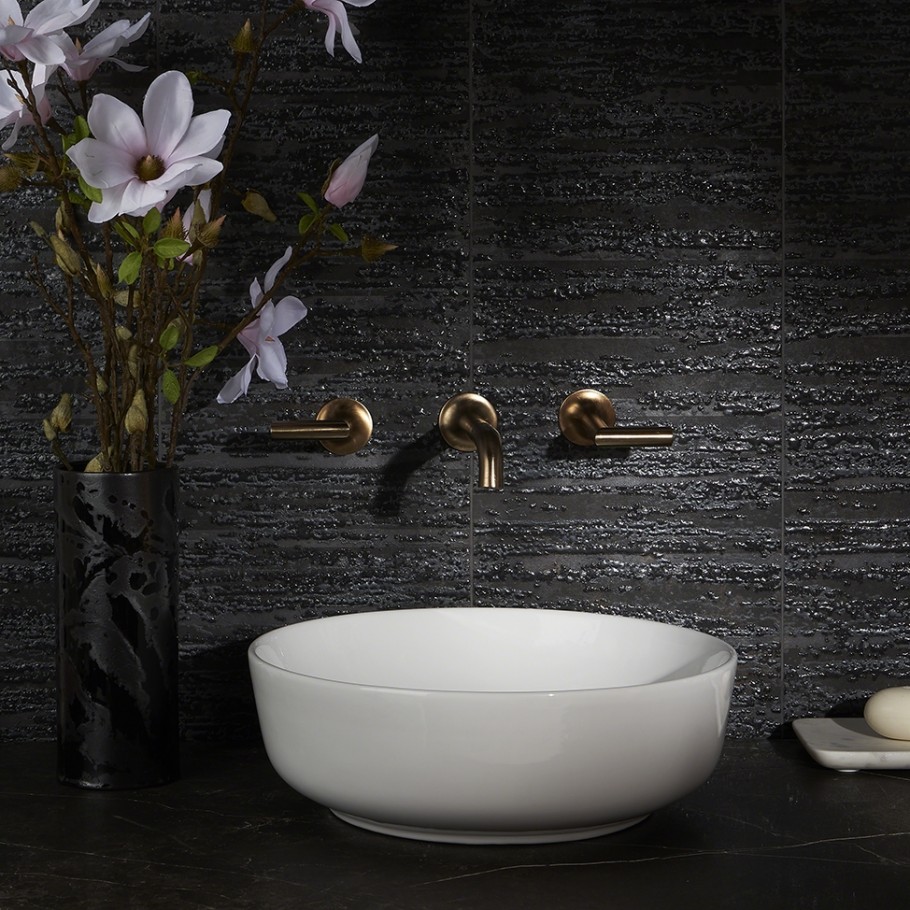 Example of Porcelain tile used in bathroom as a backsplash - dark / black tile