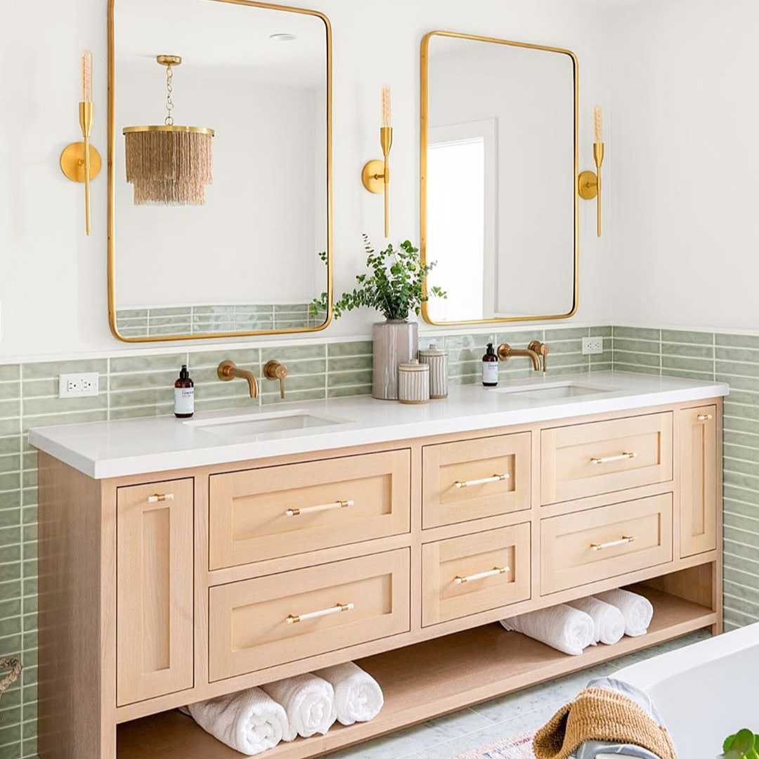 The Seaport Chameleon 2x10 Polished Ceramic Tile is shown on the wall around the bathroom sink unit. The tiles are up to waist height with white paint covering the rest of the height of wall