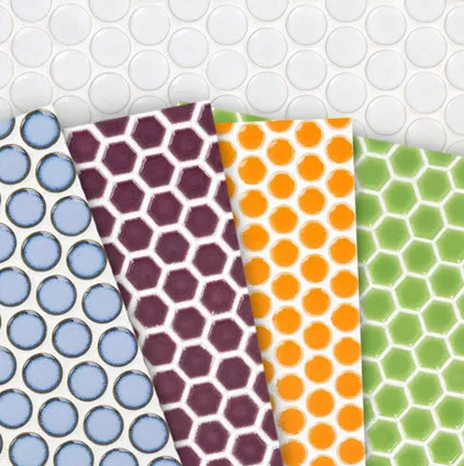 Four hexagonal tile examples in bright bold colours. Purple, blue, orange and green. 