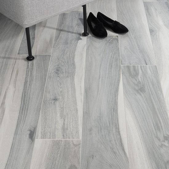Modern Wood Look Tiles shown on floor. Bright wood. Grey colour.