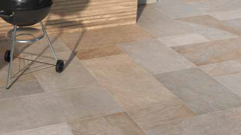 pavers shown on the floor outside with no gaps. A bbq is on top of the pavers. 