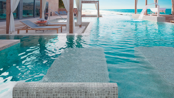 Swimming Pool Tiles on submerged sunbed in pool