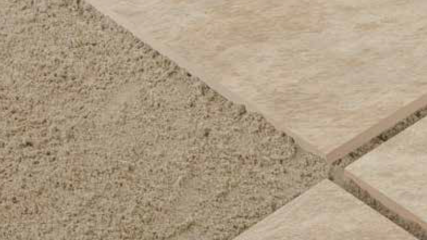 Image showing pavers laying on top of sand. There is a small gap between each paver 